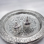 Load image into Gallery viewer, Traditional Silver Ceremonial Pooja Thali Set | Handcrafted Indian Puja Plate for Rituals | Authentic Silver Handicraft Thali for Worship | Religious Gift Idea | Hindu Prayer Essentials  Elegant Ceremonial Pooja Thali Set by Tanutra – handcrafted Indian handicraft for home decor and daily worship, featuring a polished thali with two silver boxes. Perfect for rituals, festive celebrations, or as a thoughtful gift for weddings and housewarmings. Traditional Indian metal craft in kitchenware and lifestyle deco
