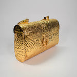 Load image into Gallery viewer, Luxurious embossed golden clutch with intricate metal patterns – perfect for evening events, weddings, and fashion-forward accessories – by Tanutra Indian craftsmanship
