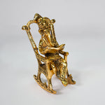 Load image into Gallery viewer, Golden Wisdom Ganesha figurine on a rocking chair | Decorative Hindu deity statue | Spiritual home decor for wisdom and success | Gold-toned Ganesha sculpture for altar, desk, or gift&quot;
