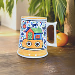 Load image into Gallery viewer, Cheerful Ceramic Mug - Hand-Painted Vibrant House Under Sunny Sky | Indian Handcrafted Ceramic Art | Tanutra - Colorful Daily Coffee Mug for Home Decor and Art Lovers
