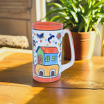 Load image into Gallery viewer, Dreamy Cottage Mug - Hand-painted Ceramic Mug with Whimsical House Design by Tanutra | Vibrant Ceramic Arts Drinkware for Coffee, Tea, and Hot Chocolate | Artistic, Colorful Mug Perfect for Home Décor or Gifts
