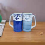 Load image into Gallery viewer, Handcrafted Indigo Bloom Ceramic Mugs with Floral and Geometric Patterns - Artisanal Blue Mugs for Coffee, Tea, Kitchen Décor, and Gifting | Tanutra
