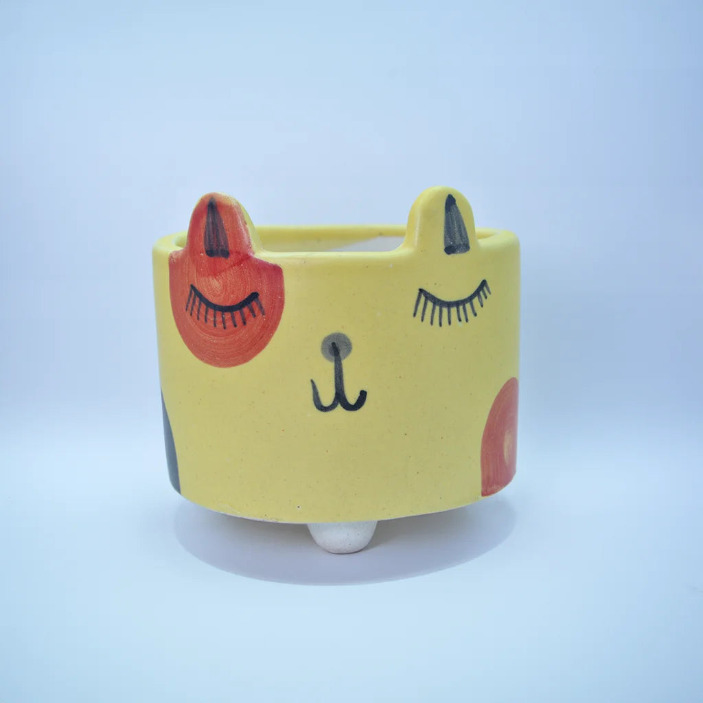 Sunny Critter Planter - Animal-inspired ceramic planter with a cheerful yellow finish, perfect for small plants, succulents, or herbs. Playful home decor accent from Tanutra's Ceramic Arts collection.