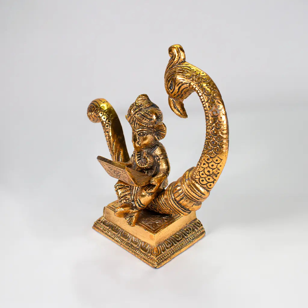 Peacock Ganesha Grace - Exquisite Golden Sculpture of Lord Ganesha and Peacock - Spiritual and Decorative Centerpiece by Tanutra | Indian Handicrafts |