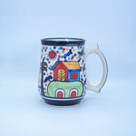 Load image into Gallery viewer, Sunny Village Mug - Hand-painted Ceramic Coffee and Tea Mug with Vibrant Village Scene - Artistic Homeware for Desk Décor, Gifting, and Display - Part of Tanutra&#39;s Ceramic Arts Collection
