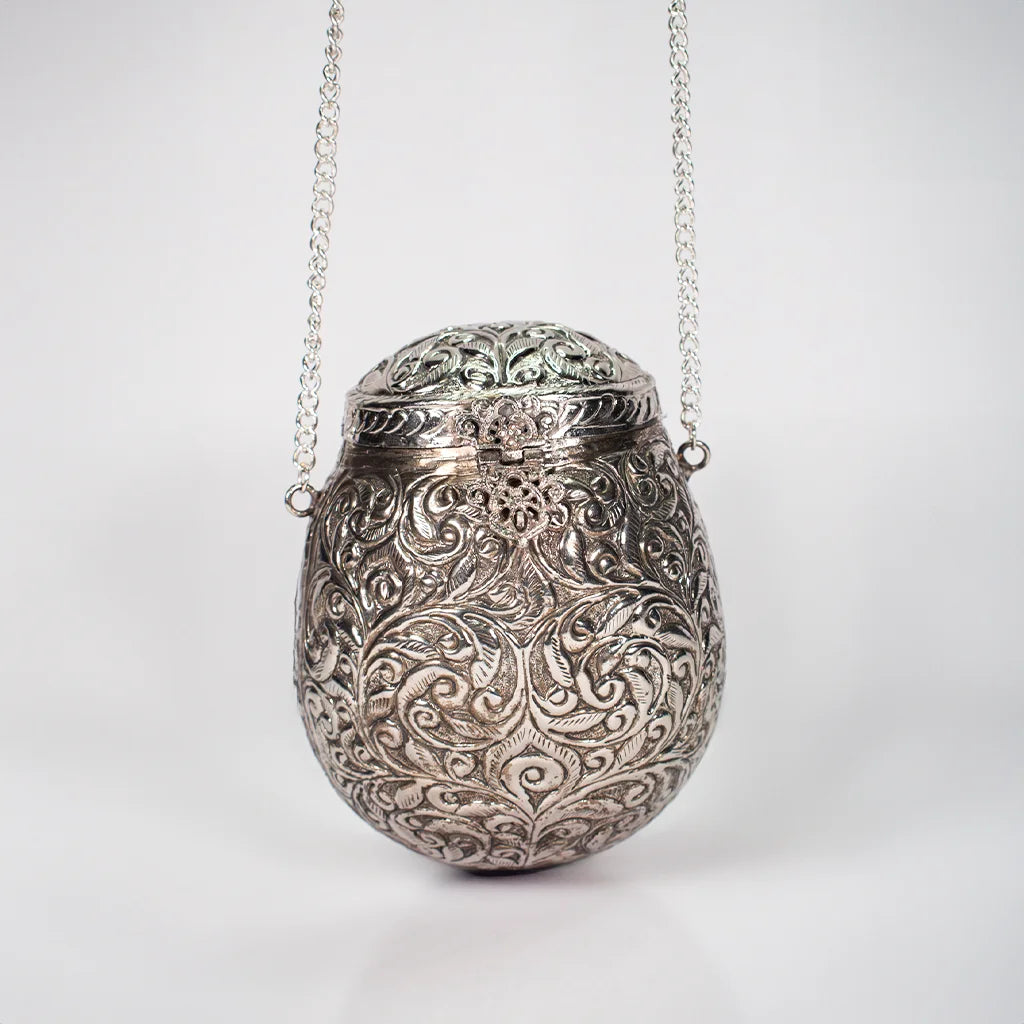 "Ornate Silver Purse – Exquisite Aluminum Handicraft Adding Modern Elegance to Home Decor by Tanutra Handicrafts.