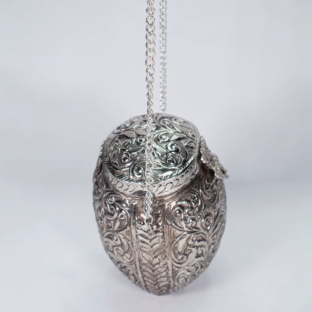 "Ornate Silver Purse – Exquisite Aluminum Handicraft Adding Modern Elegance to Home Decor by Tanutra Handicrafts.