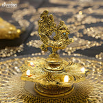 Load image into Gallery viewer, Peacock Glow Lamp - Modern aluminum home decor by Tanutra Handicrafts, perfect for adding contemporary elegance and artistic flair to any spaceElegant brass Peacock Glow Lamp showcasing intricate Indian craftsmanship, perfect for home decor, festive celebrations, spiritual rituals, and as a unique gift for housewarmings. Embrace the beauty of traditional Indian artistry with this exquisite lamp, ideal for creating a warm ambiance during Diwali and enhancing meditation spaces.
